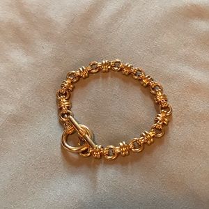 Gold tone bracelet with toggle closure